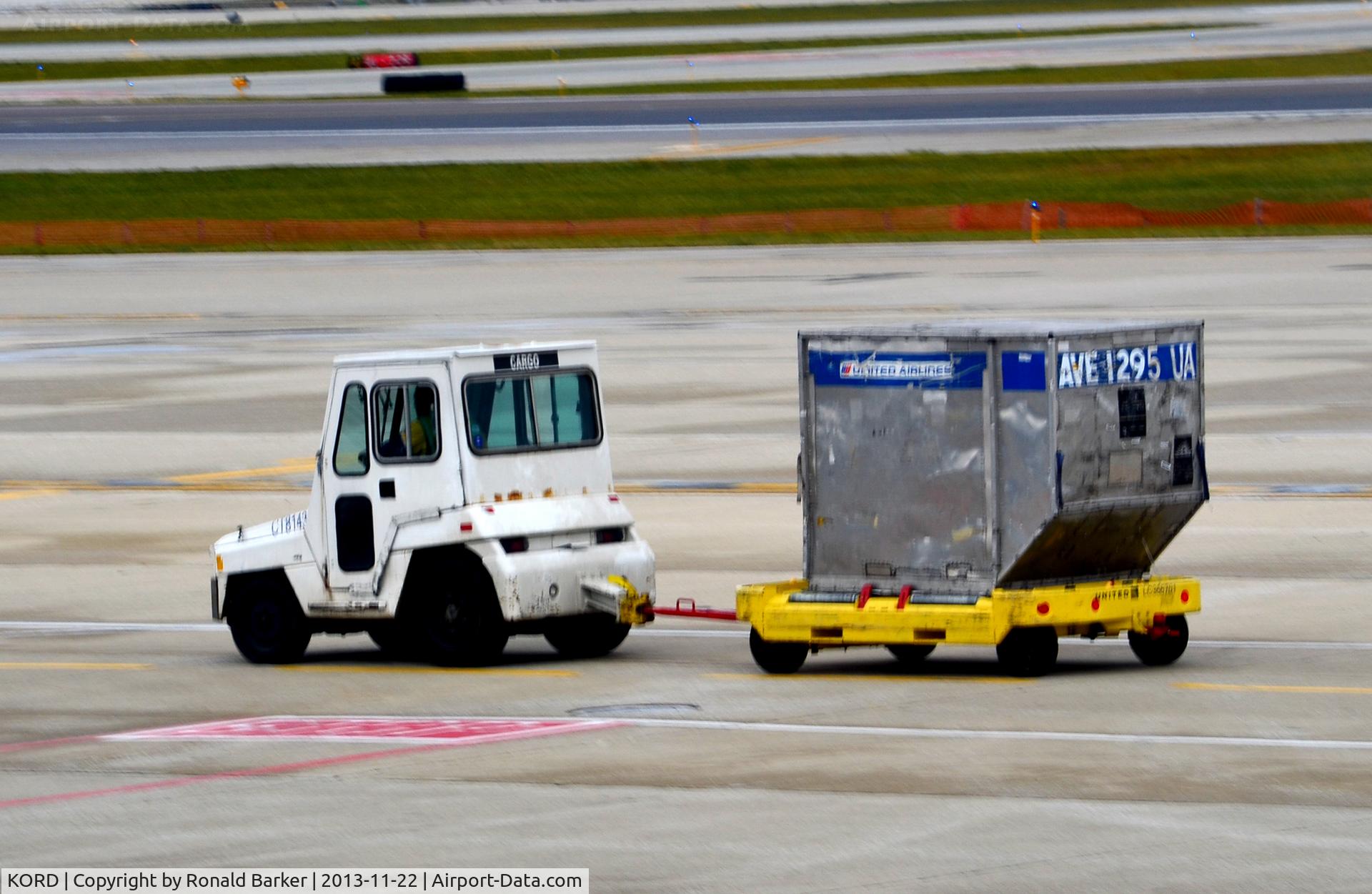 Chicago O'hare International Airport (ORD) - Tug pulling cargo container O'Hare