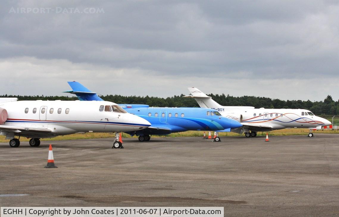 Bournemouth Airport, Bournemouth, England United Kingdom (EGHH) - M-OOUN and friends on JETS apron