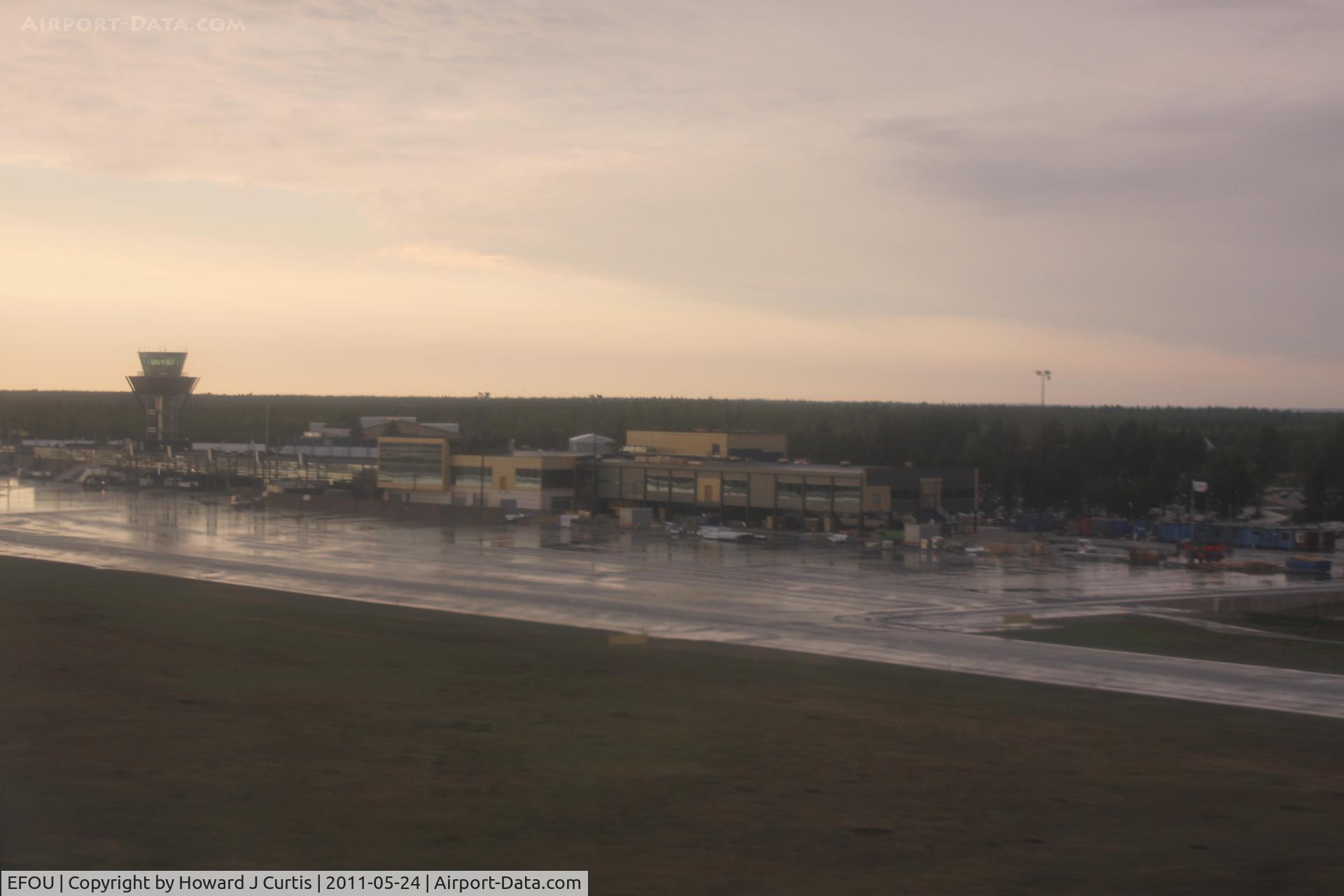 Oulu Airport, Oulunsalo Finland (EFOU) - A shot of the empty apron here taken from a landing Finnair Embraer 190 at 7.54pm local.