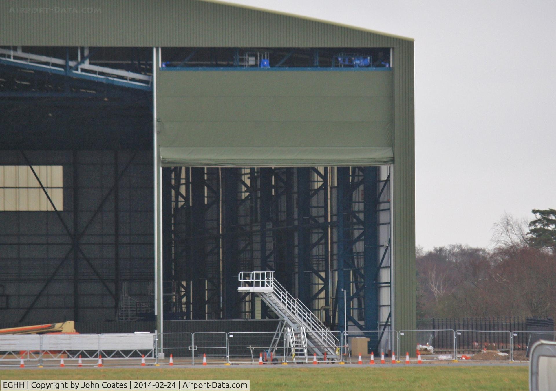 Bournemouth Airport, Bournemouth, England United Kingdom (EGHH) - Interesting door type on new hangar extensions.