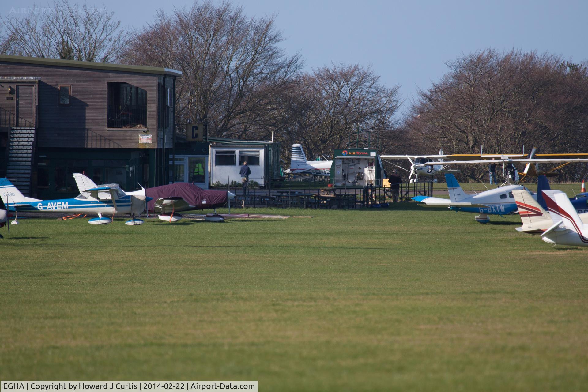 Compton Abbas Airfield Airport, Shaftesbury, England United Kingdom (EGHA) - A view towards the restaurant (left), outside seating area (middle) and part of the flight line.