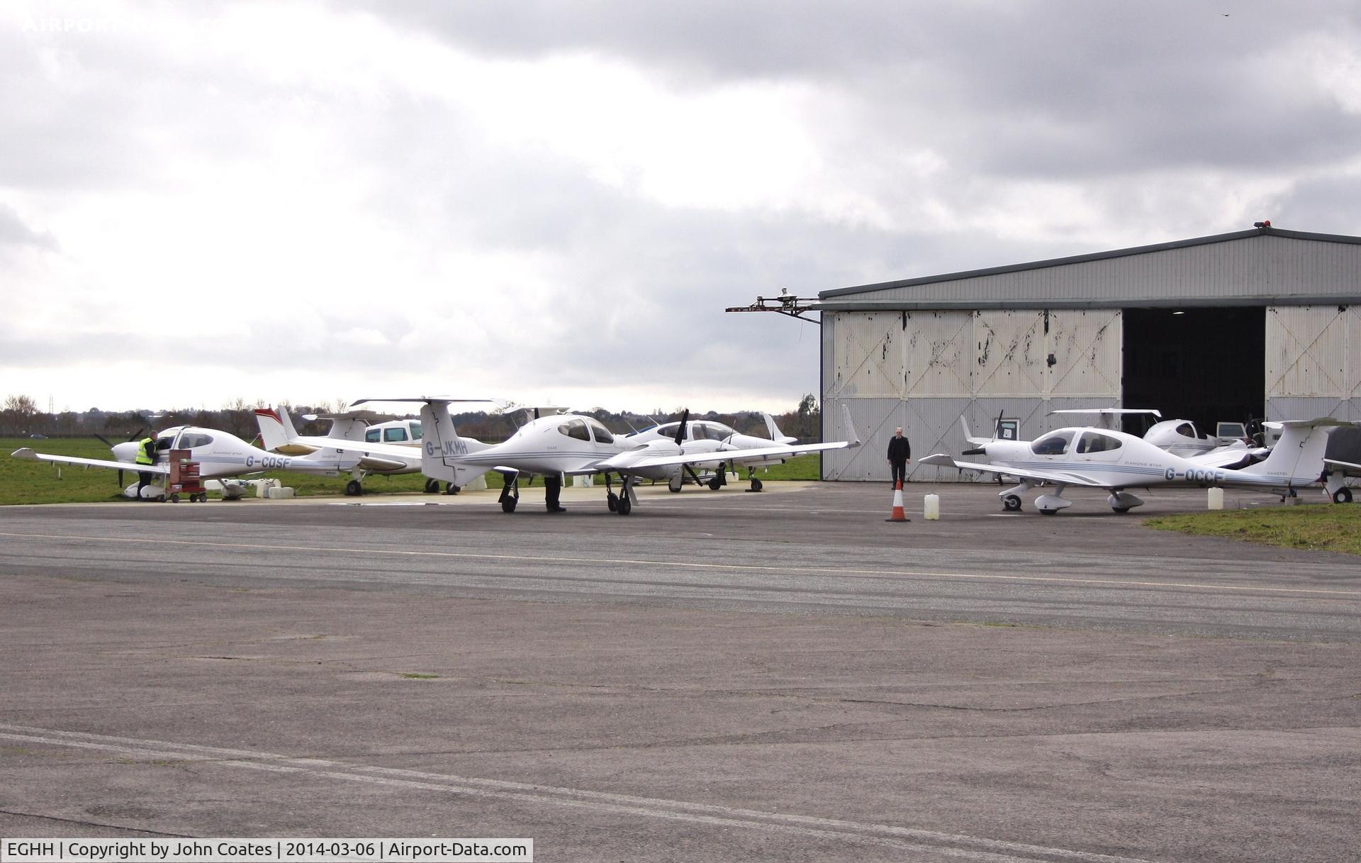 Bournemouth Airport, Bournemouth, England United Kingdom (EGHH) - Busy apron at Wordwide Avn. including G-CDSF, G-JKHM and G-OCCF