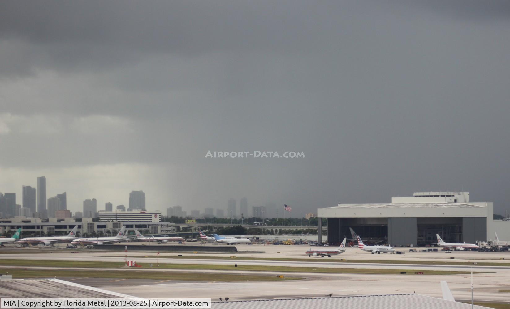 Miami International Airport (MIA) - Miami northeast ramp with storm forming over Downtown