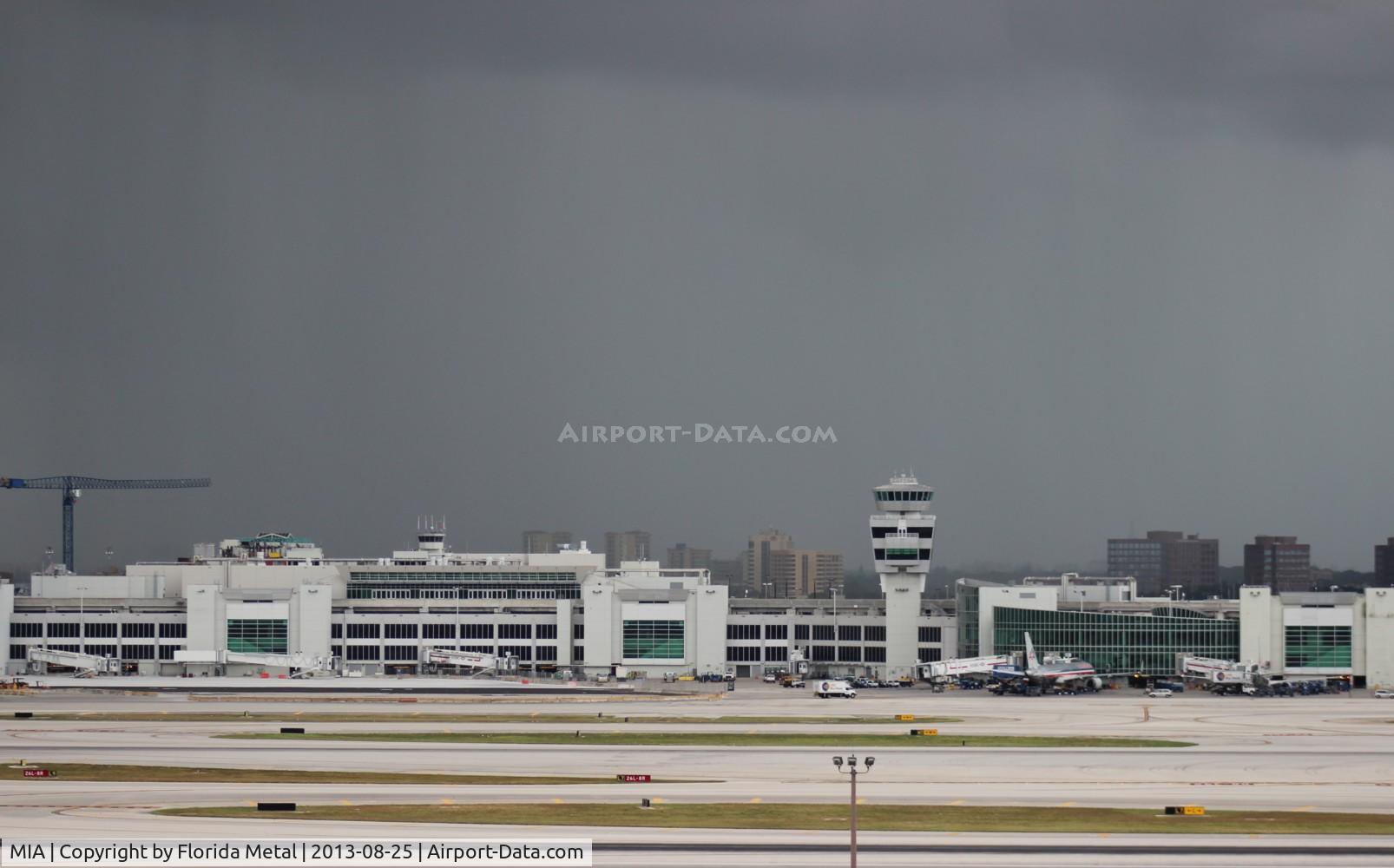Miami International Airport (MIA) - Miami's American Airlines terminal with storm to the south