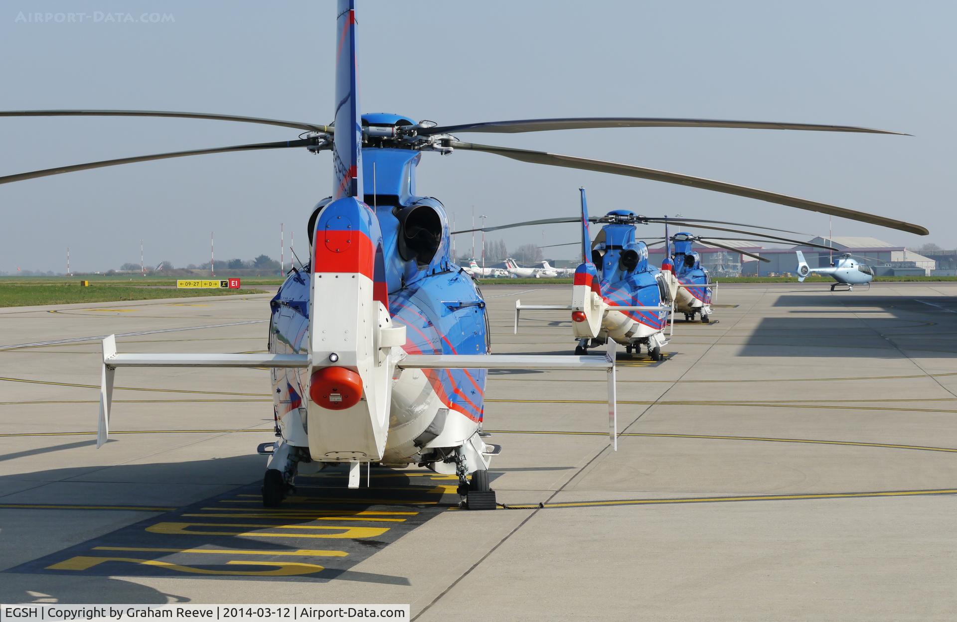 Norwich International Airport, Norwich, England United Kingdom (EGSH) - Dancopter, Eurocopter EC 155's lined up outside Saxonair.