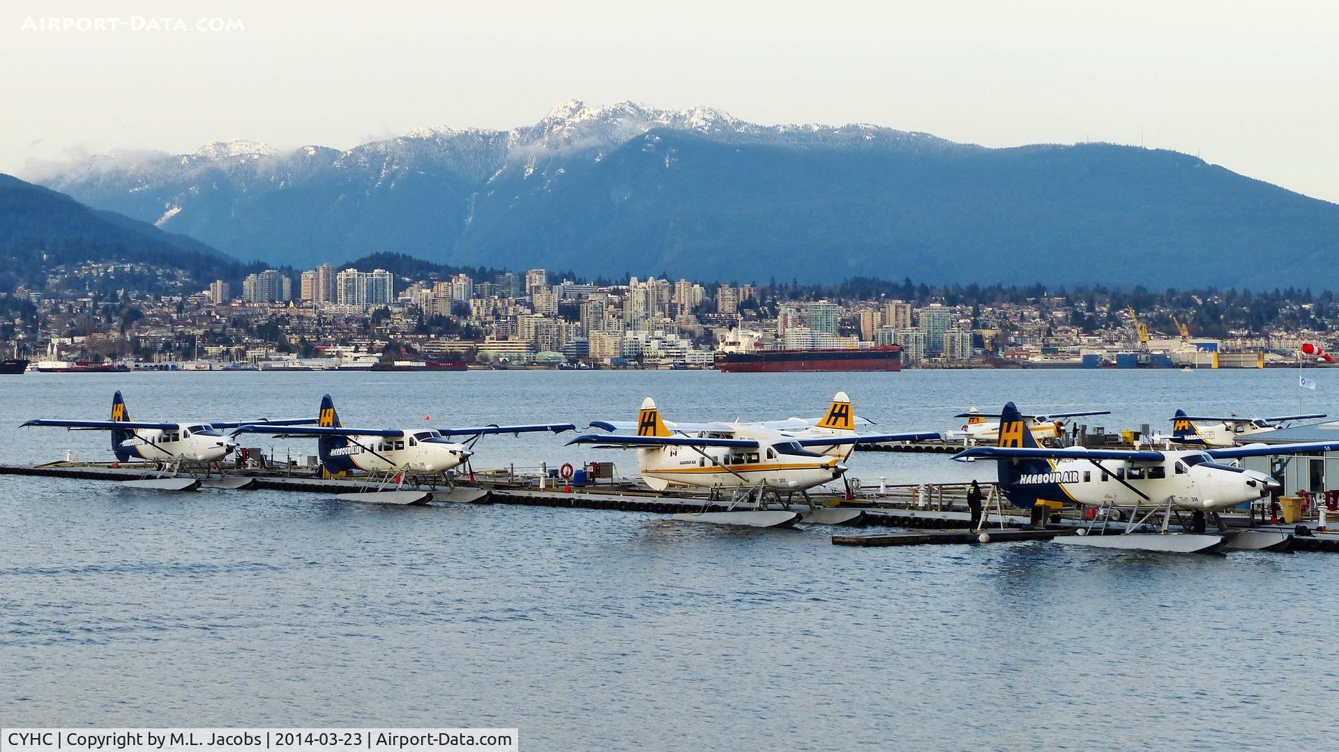 Vancouver Harbour Water Airport (Vancouver Coal Harbour Seaplane Base), Vancouver, British Columbia Canada (CYHC) - Harbour Air terminal in Coal Harbour in the early spring evening.  City of North Vancouver across Vancouver Harbour in the background.