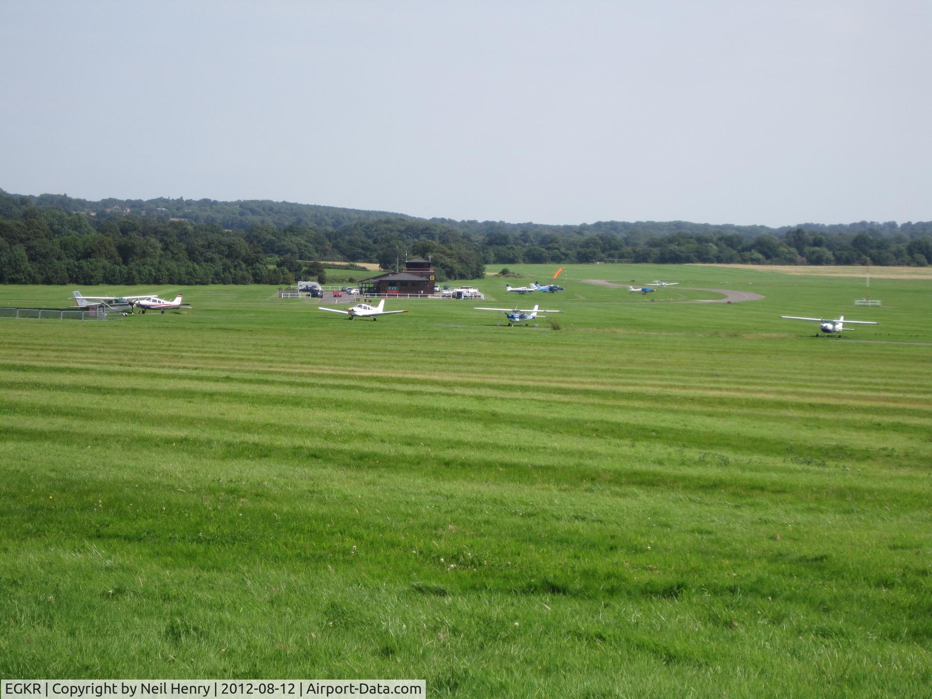 Redhill Aerodrome Airport, Redhill, England United Kingdom (EGKR) - Photo taken 12 August 2012 from adjacent field being used as car parking for Redhill Steam Rally