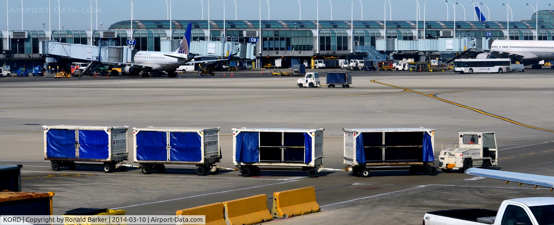Chicago O'hare International Airport (ORD) - Baggage cart train at O'Hare