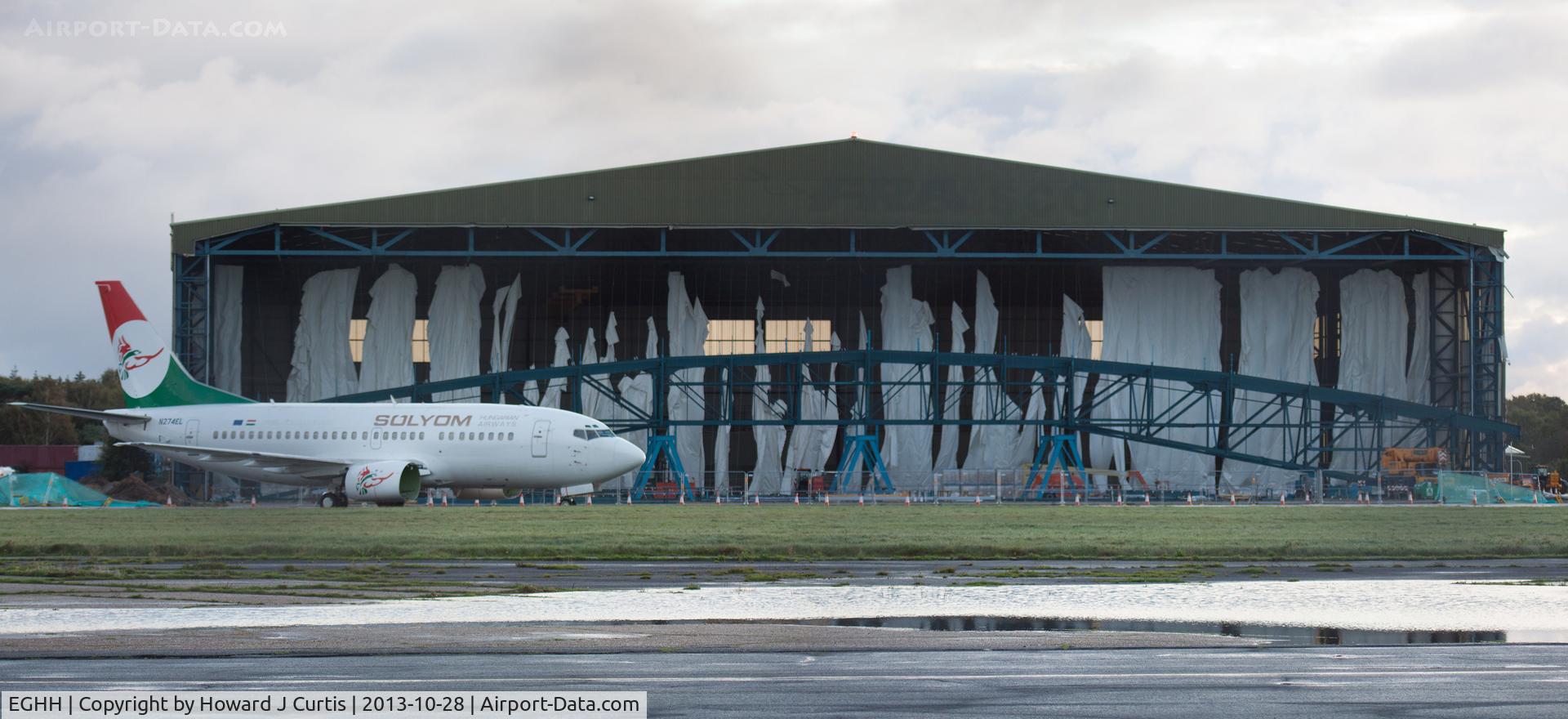 Bournemouth Airport, Bournemouth, England United Kingdom (EGHH) - Shredded curtain in the former BASCO hangar which was being extended. The storm the night before wreaked havoc with the curtain.