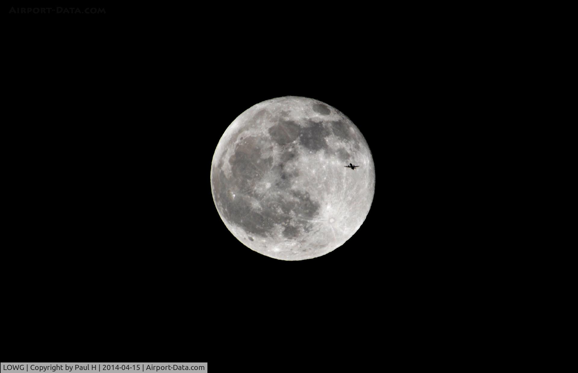 Graz Airport, Graz Austria (LOWG) - Embraer in front of moon
