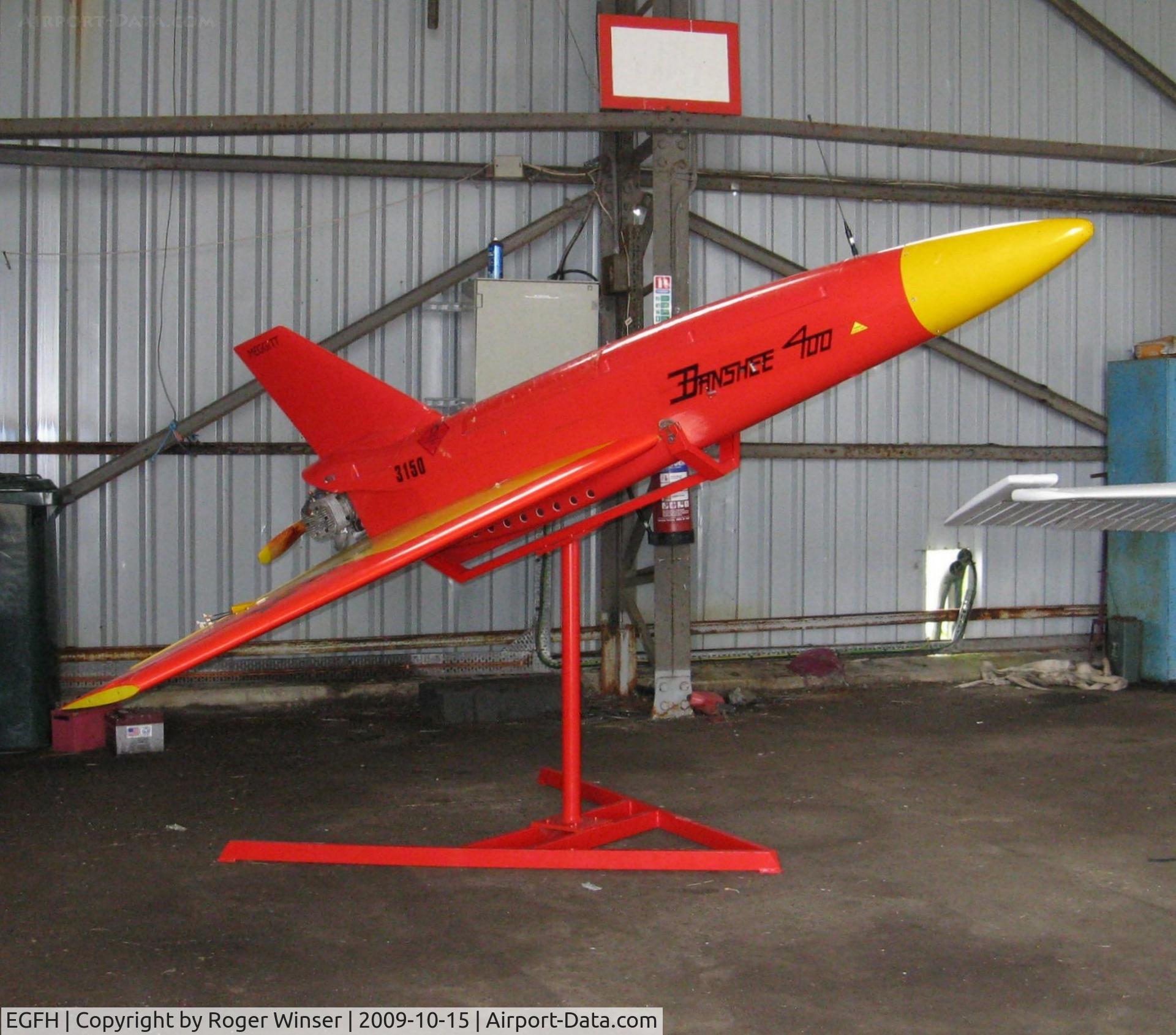 Swansea Airport, Swansea, Wales United Kingdom (EGFH) - Out of service Meggitt BTT-3 Banshee 400 target drone s/n 3150 stored at Swansea Airport under the care of 636 VGS. Moved to the Boscombe Down Aviation Collection at Old Sarum Airfield by April 2015. 