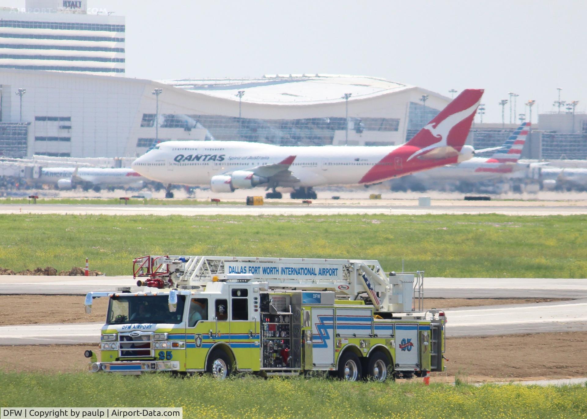 Dallas/fort Worth International Airport (DFW) - DFW's finest with a Qantas 747 taxiing to its gate after landing. 