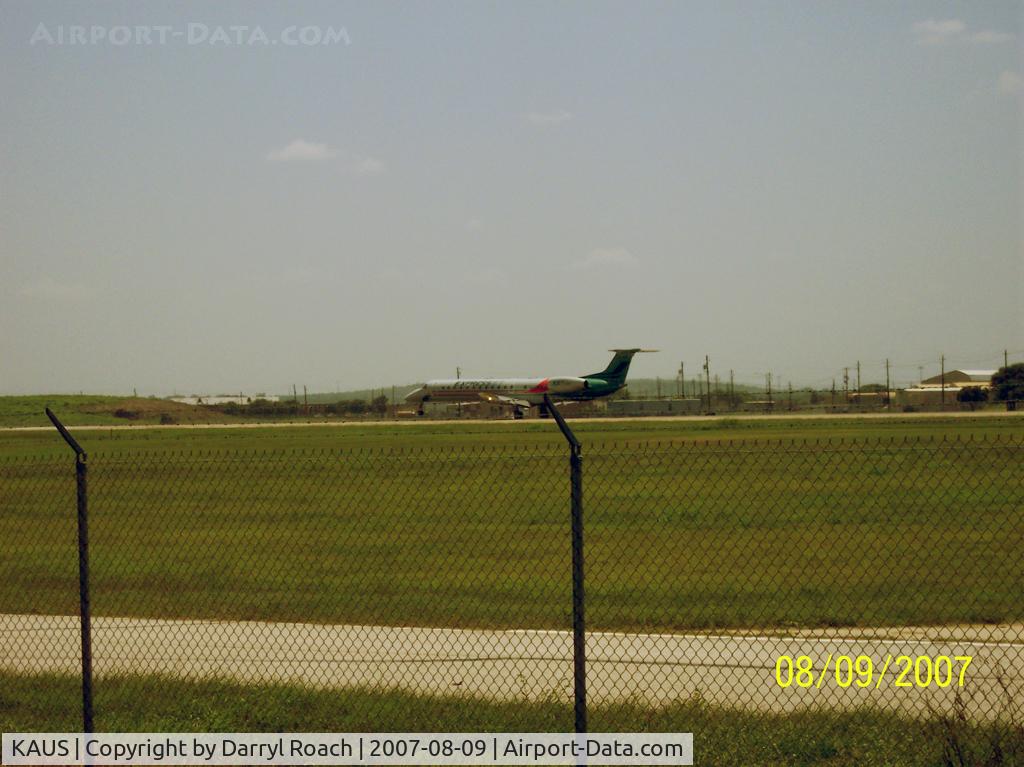 Austin-bergstrom International Airport (AUS) - BTA E145 touches down 17L.