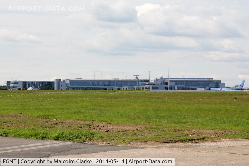 Newcastle Airport, Newcastle upon Tyne, England United Kingdom (EGNT) - Newcastle airport's terminal buildings viewed from the south side of the runway. May 14 2014.