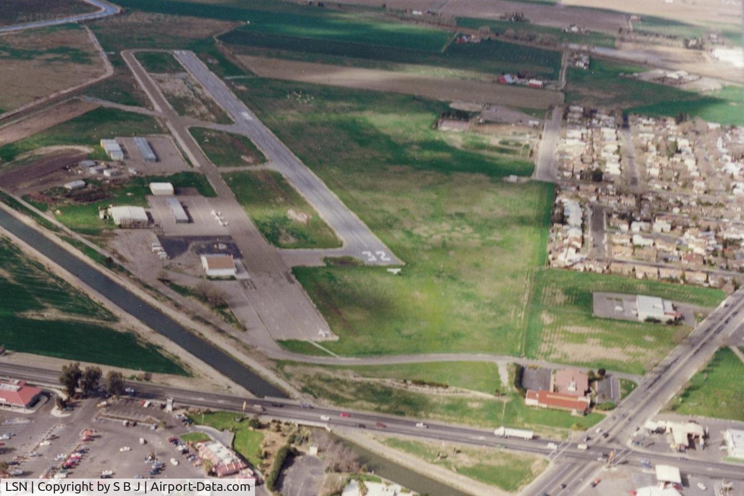 Los Banos Municipal Airport (LSN) - L B as it looked in 1994 with N9078E on very short final.This was one of our many stops at LB  to eat! View is north.