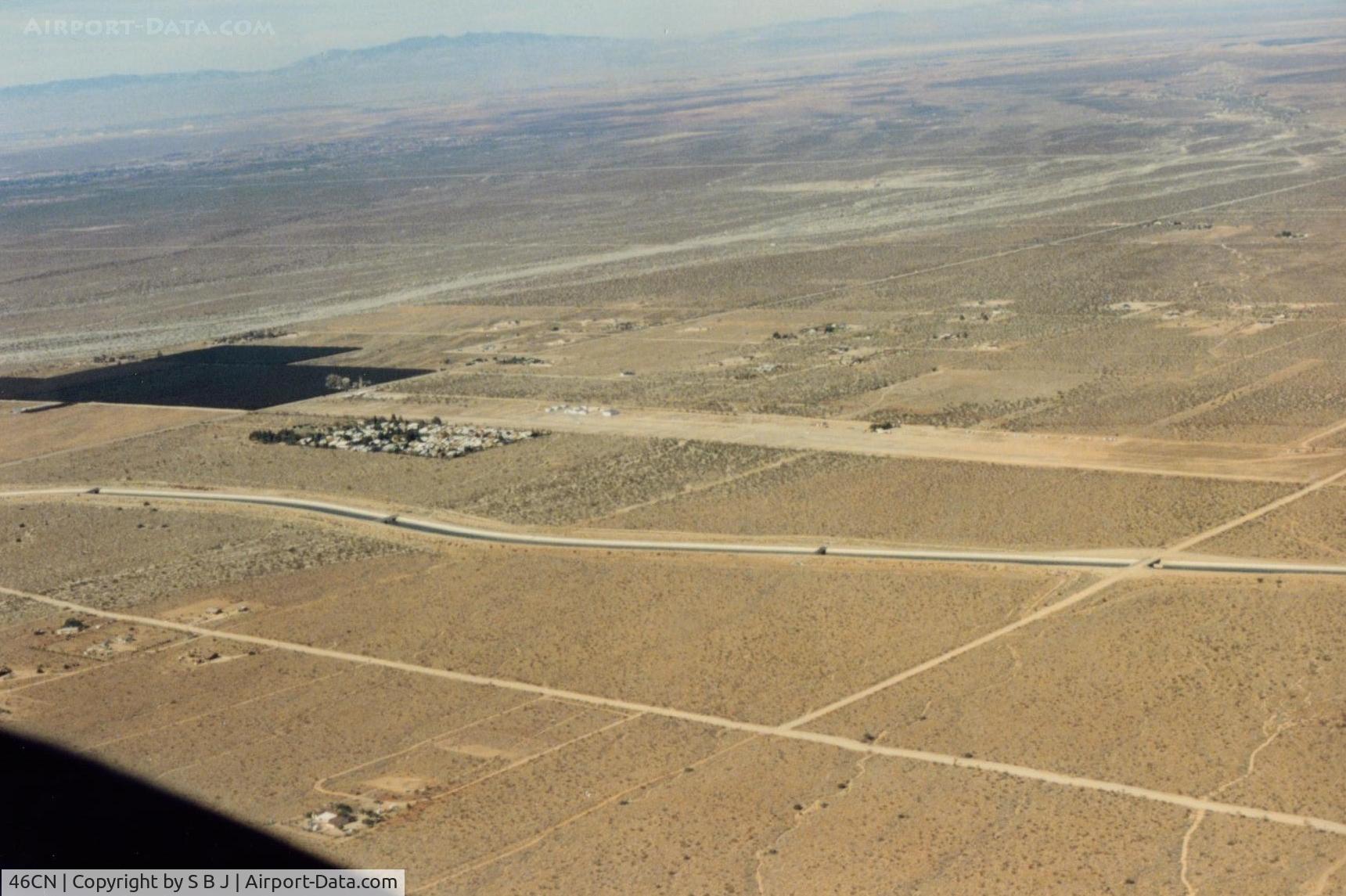 Crystal Airport (46CN) - Difficult to see but its next to the housing development and the dark area. View is northeast.
