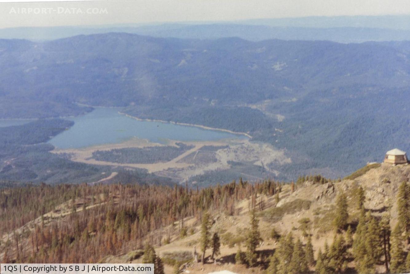 Gravelly Valley Airport (1Q5) - Looking at Gravelly Valley airport from the north to the south.The top of Hull Mt.(6873 feet) is seen on the right.The elevation of 1Q5 is 1900 feet. The fire watch building burned down in 1992.        