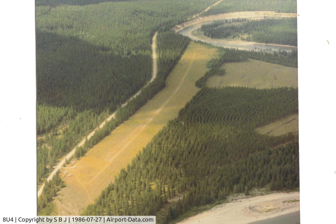 Spotted Bear /usfs/ Airport (8U4) - Spotted Bear in the summer of 1986. Not exactly a serious backcountry strip, but still nice. That is the south fork of the Flathead river and with the view to the north.