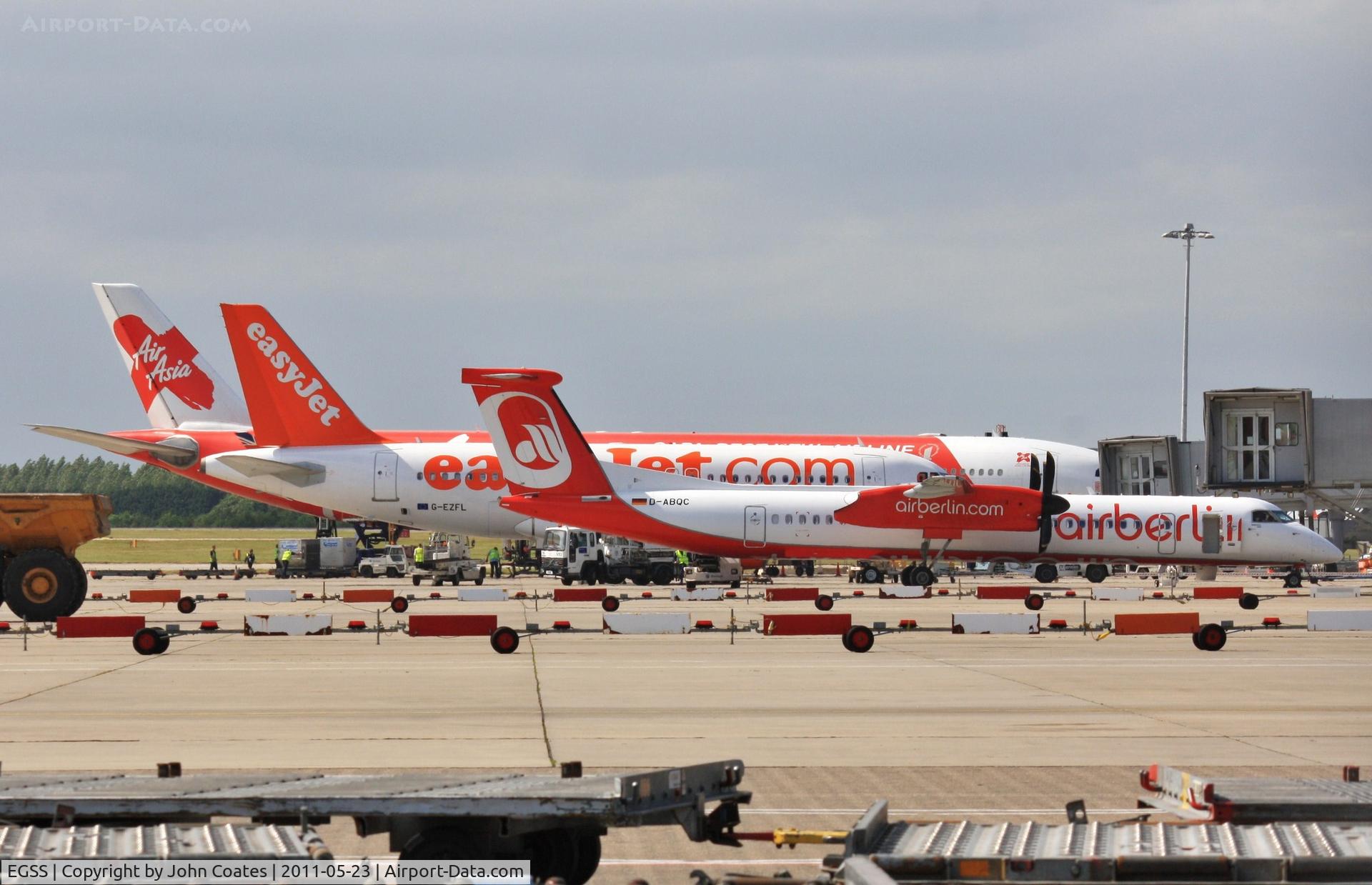 London Stansted Airport, London, England United Kingdom (EGSS) - Apron includin D-ABQC, G-EZFL and Air Asia