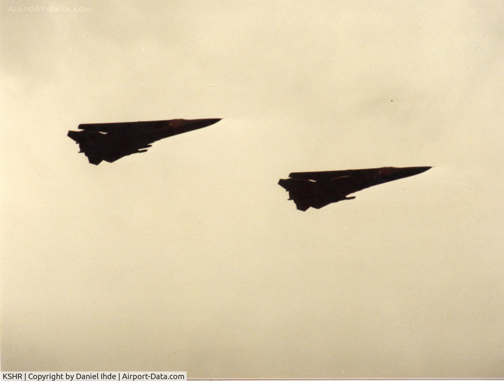 Sheridan County Airport (SHR) - Mountain Home AFB FB-111's doing a supersonic low pass in 1983 at KSHR