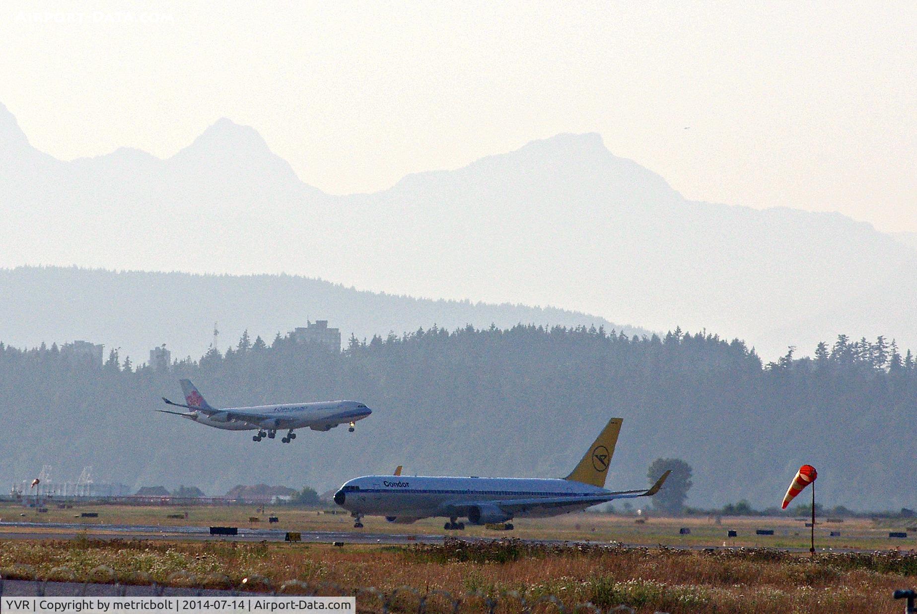 Vancouver International Airport, Vancouver, British Columbia Canada (YVR) - Condor D-ABUM to FRA,CAL B-18801 arriving from TPE
