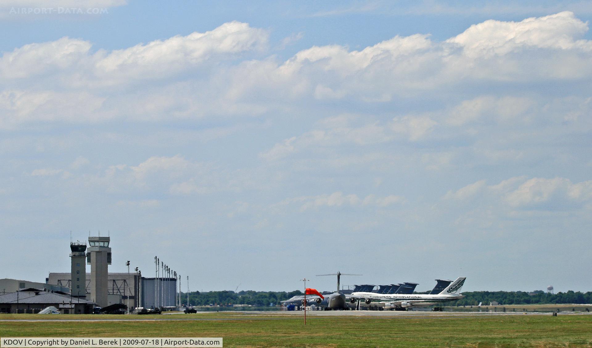 Dover Afb Airport (DOV) - The ramp of Dover Air Force Base, as seen from the southeast corner (at the Air Mobility Command Museum).  A civilian Evergreen Boeing 747 is on a military charter.