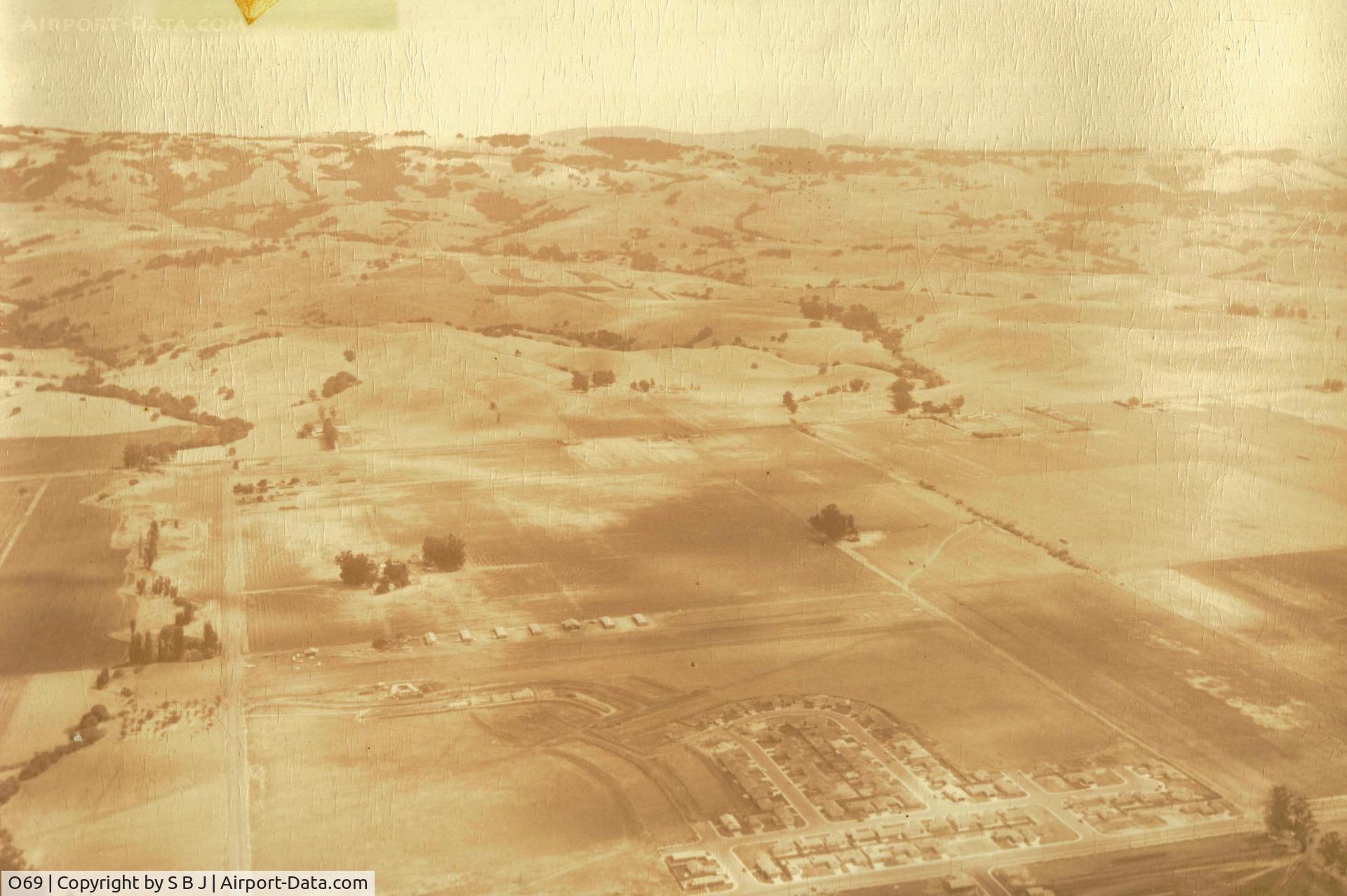 Petaluma Municipal Airport (O69) - Petaluma airport.Have seen a 1965 picture that shows 8 houses built (5 in this picture) nearest airport,so this picture must be around 1963-64. View is to the east.