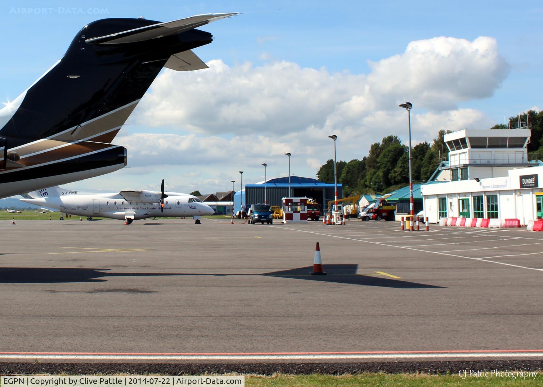 Dundee Airport, Dundee, Scotland United Kingdom (EGPN) - Apron shot- Flybe/Loganair Dornier G-BYMK waits to depart to Stansted (EGSS), next to visiting Challenger bizjet N354WG