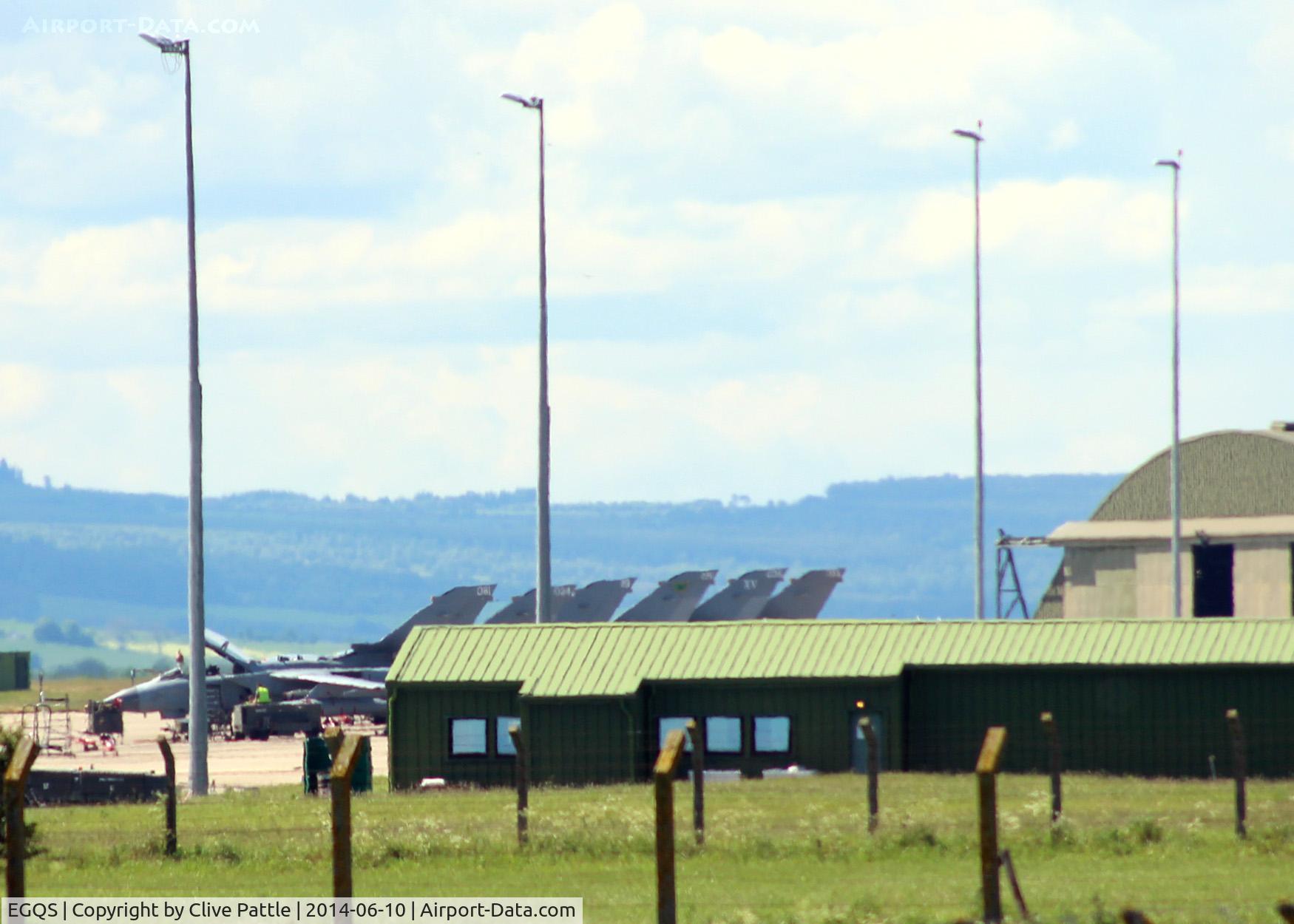 RAF Lossiemouth Airport, Lossiemouth, Scotland United Kingdom (EGQS) - Close-up of 15R Sqn buildings with a row of Tornado GR.4 at RAF Lossiemouth EGQS