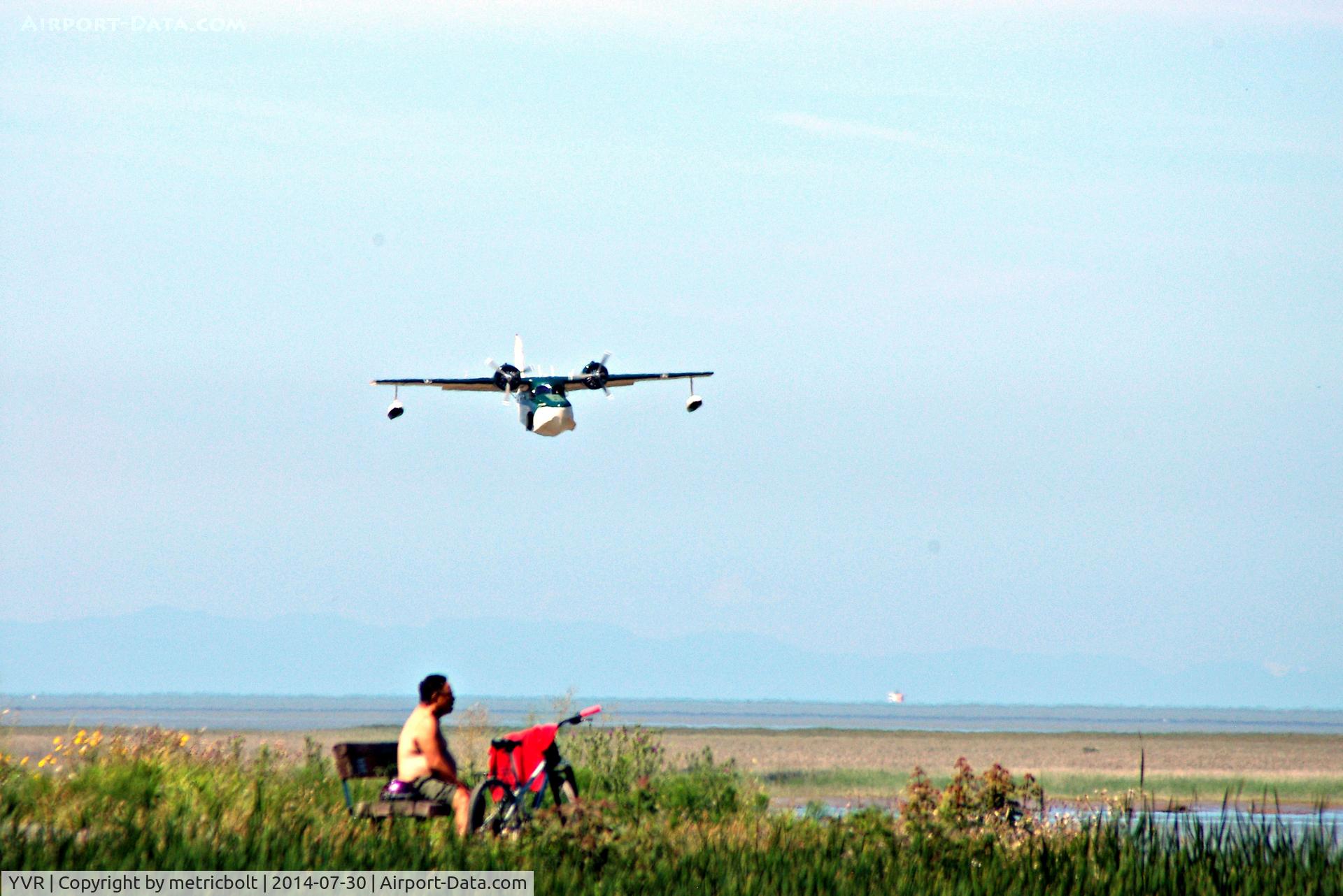 Vancouver International Airport, Vancouver, British Columbia Canada (YVR) - Enjoying the sea breeze and watching the seaplanes.