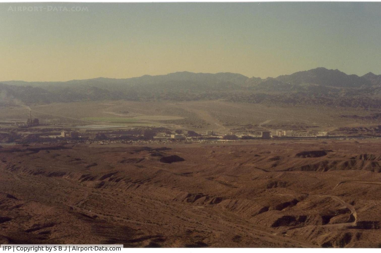 Laughlin/bullhead International Airport (IFP) - Picture on downwind of Bullhead City airport in 1992. View is to the west and Laughlin,Nevada (casinos) across the river. Runway is barely seen in this picture.