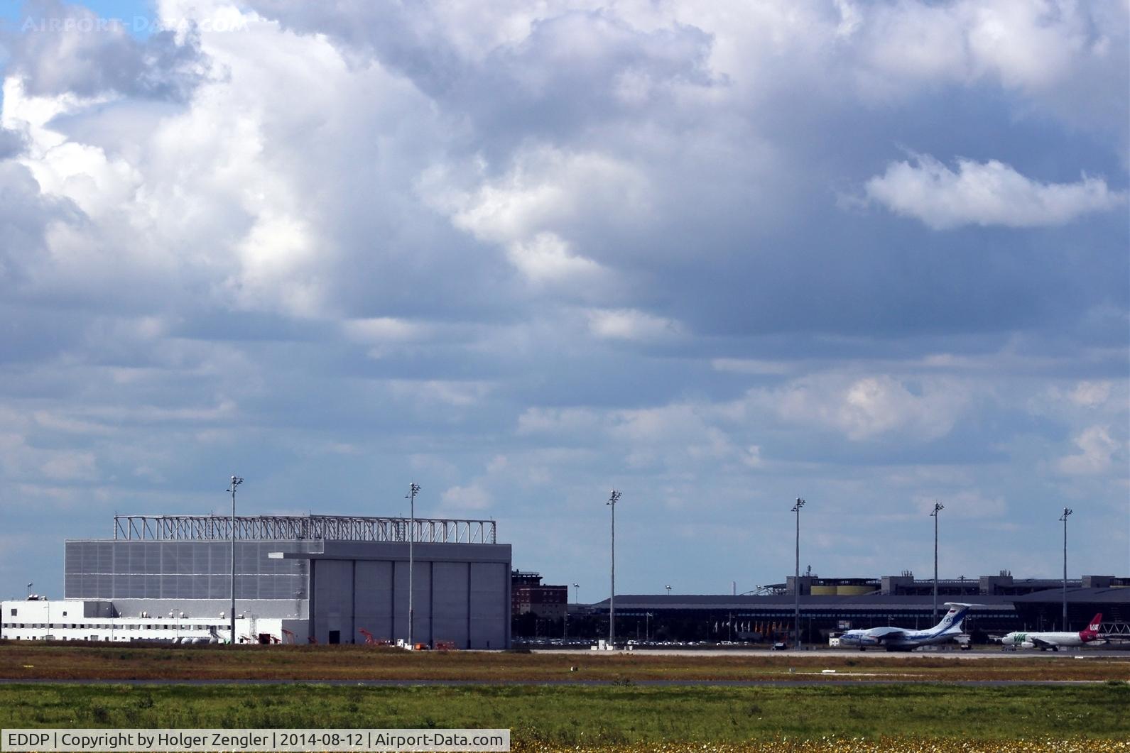 Leipzig/Halle Airport, Leipzig/Halle Germany (EDDP) - Maintenance hangar for VD-An 124 and apron 3 with Il 76 and a VIA Air A 320. In the back airport main building and old tower.
