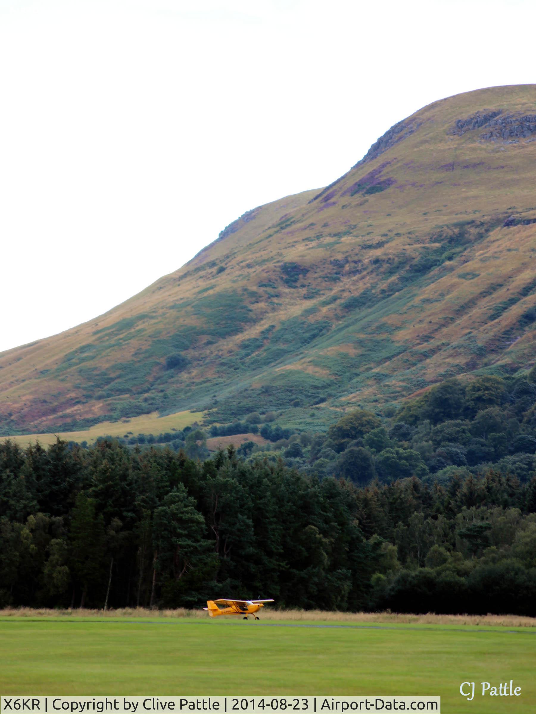X6KR Airport - Portmoak Gliding Field, Kinross, Scotland, with Towing aircraft G-OSGU and the Lomond Hills in the background