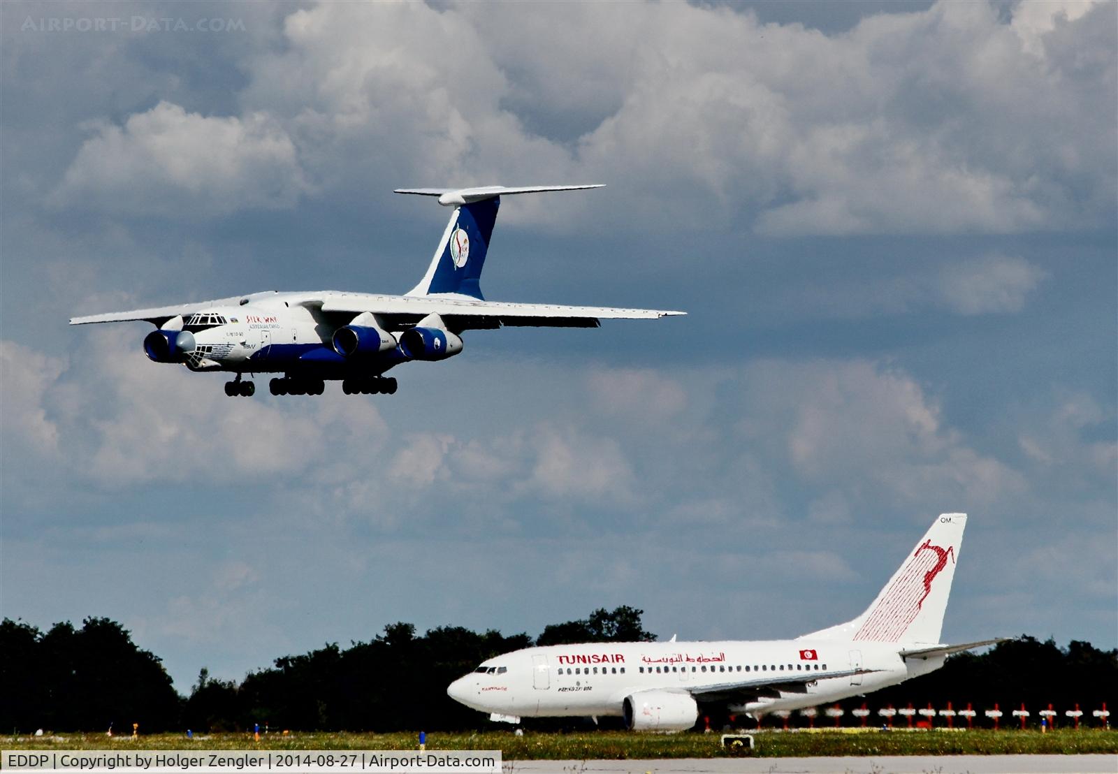 Leipzig/Halle Airport, Leipzig/Halle Germany (EDDP) - Inbound traffic is roaring down on rwy 26R observed by outbound traffic at holding point 26R....