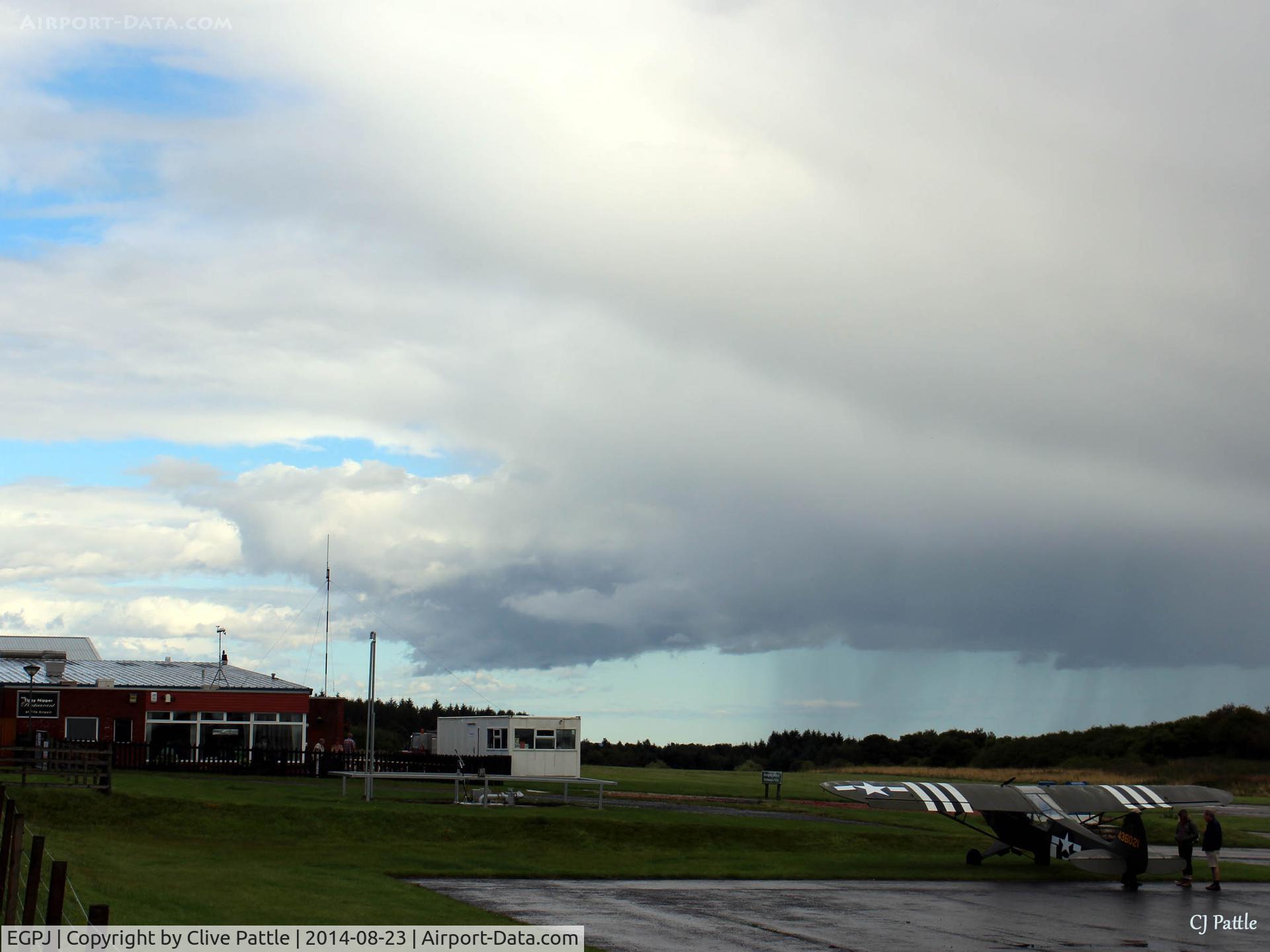 Fife Airport, Glenrothes, Scotland United Kingdom (EGPJ) - Looking east across apron towards the clubhouse/restaurant and hangars