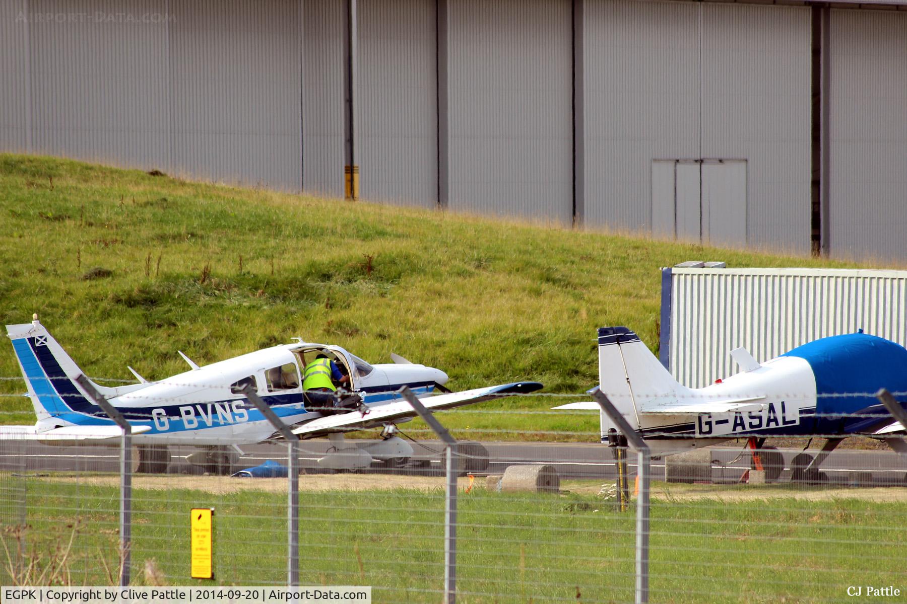 Glasgow Prestwick International Airport, Glasgow, Scotland United Kingdom (EGPK) - A couple of the resident Prestwick Flying Club aircraft parked near Taxyway 'P'