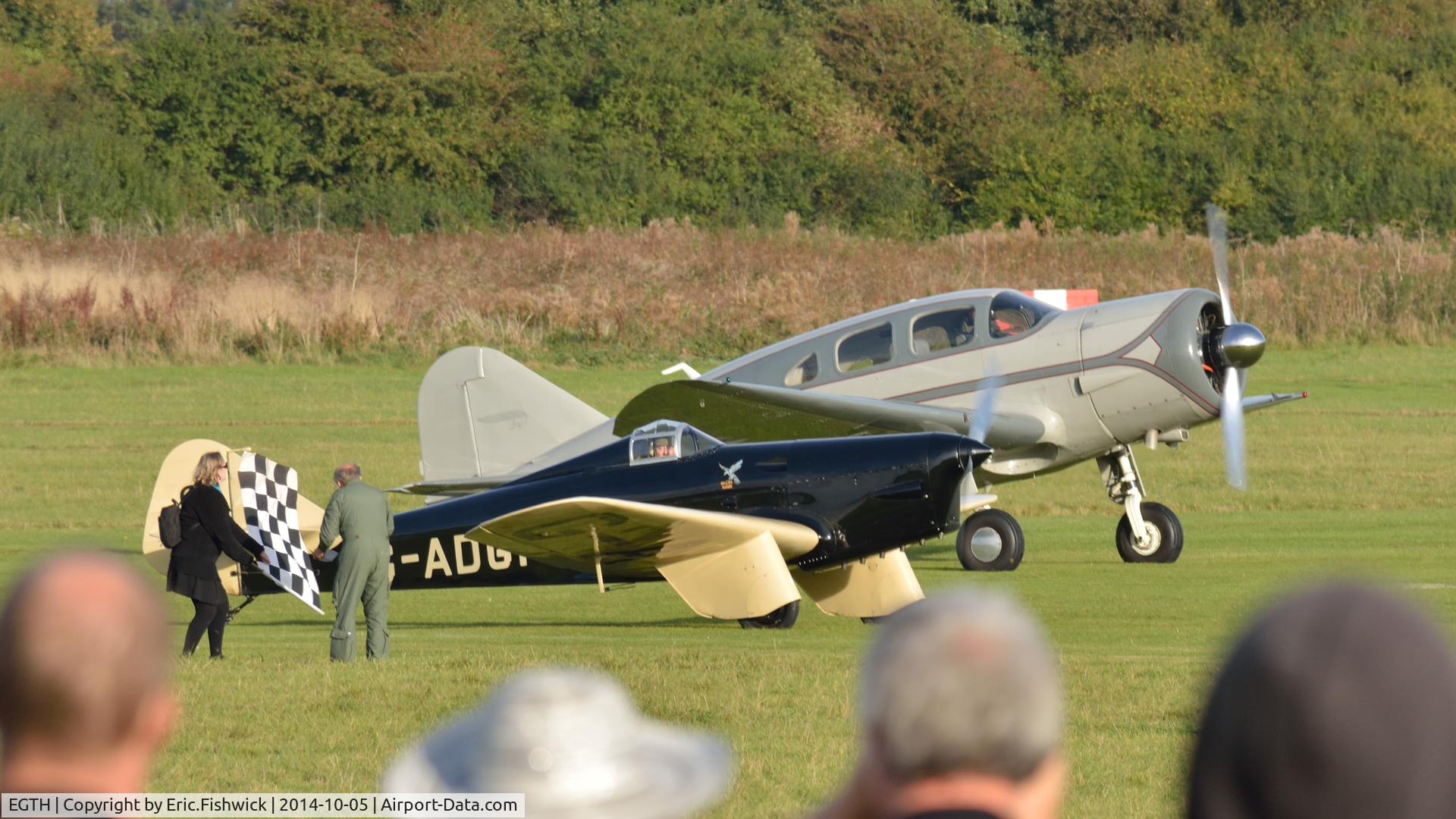 EGTH Airport - The Flag drops for the two fastest aeroplanes at the start line of the Shuttleworth Mock Handicap Air Race, Oct. 2014.