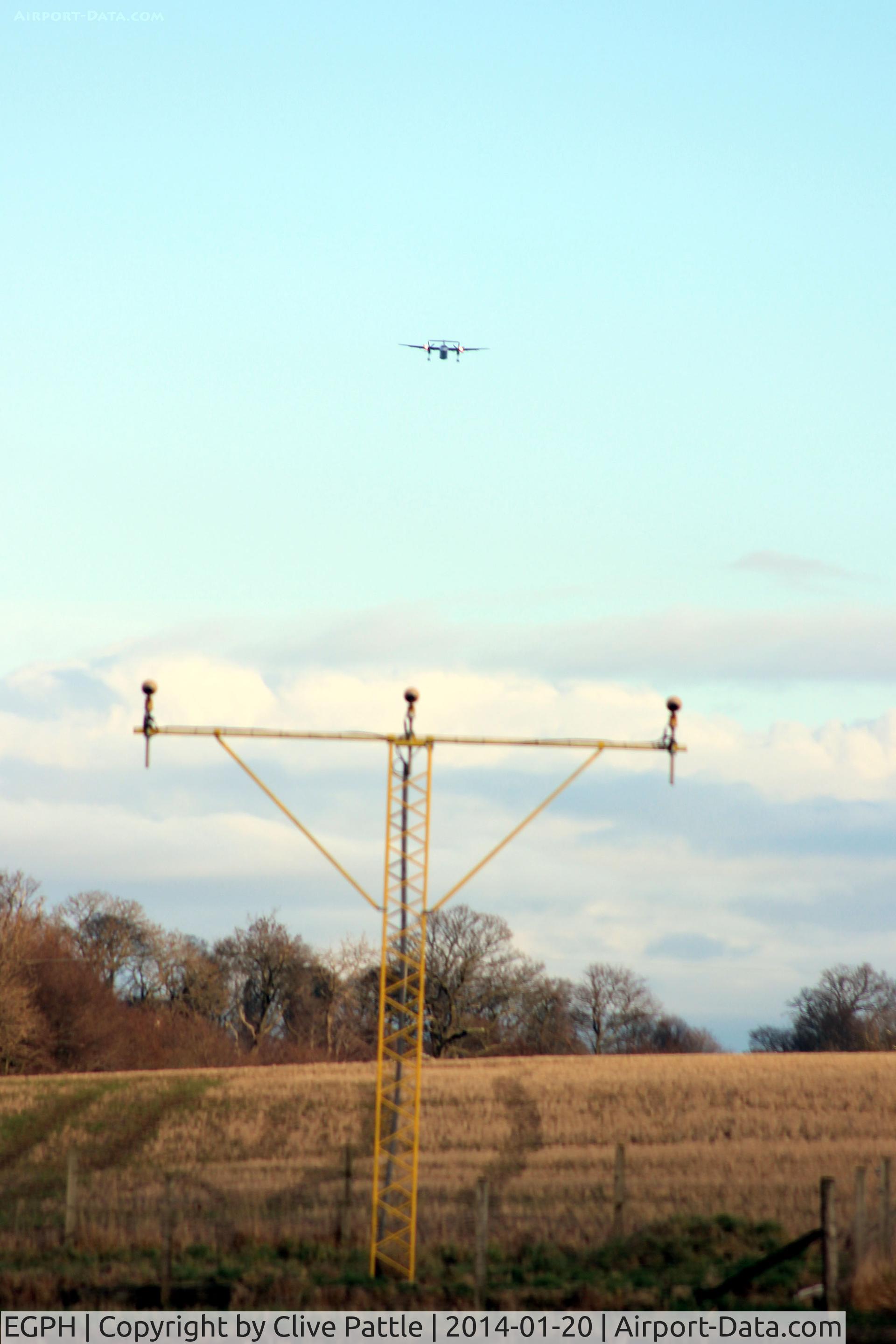 Edinburgh Airport, Edinburgh, Scotland United Kingdom (EGPH) - Landing lights at EGPH with a Flybe Dash 8 on approach.