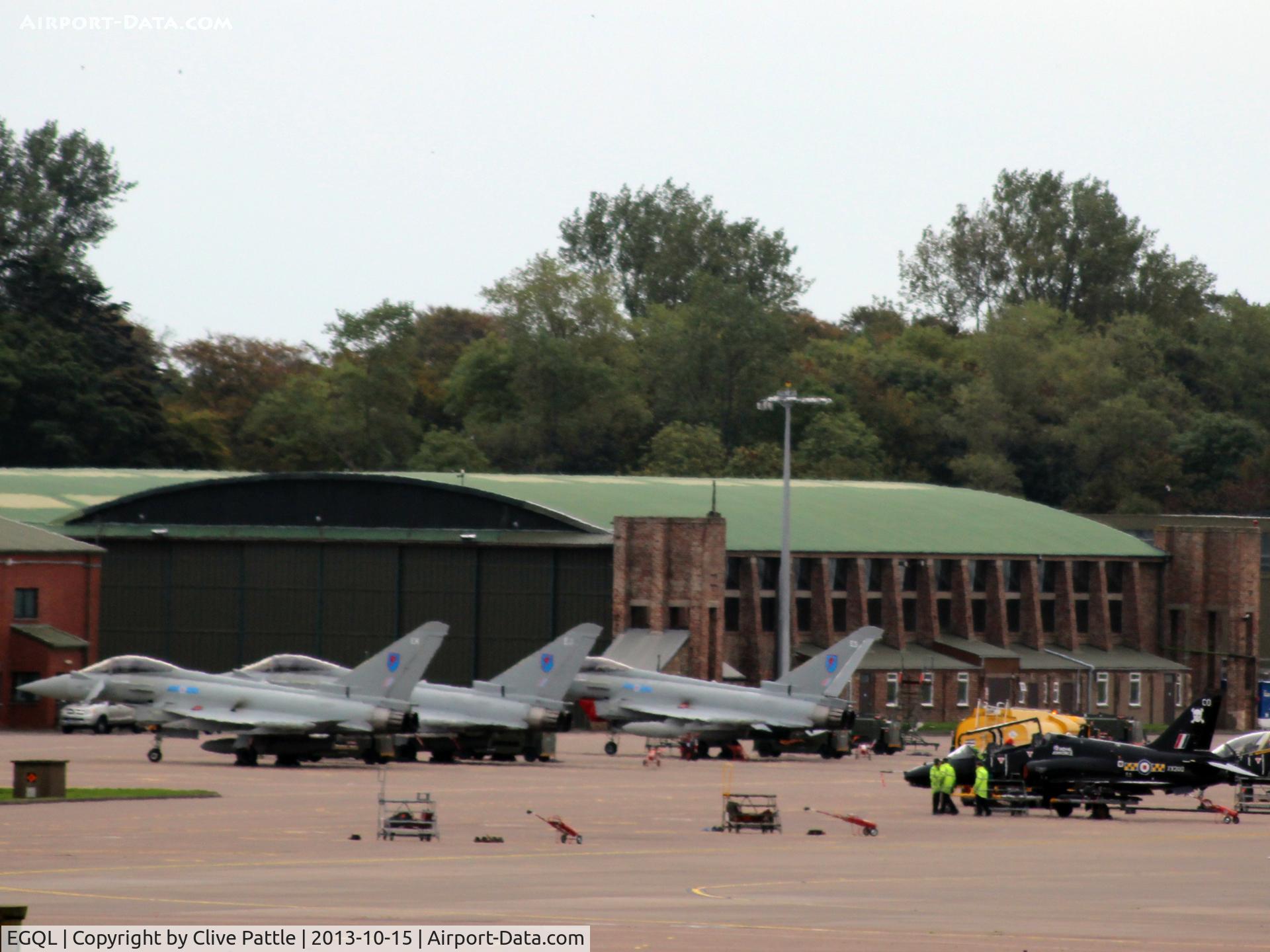 RAF Leuchars Airport, Leuchars, Scotland United Kingdom (EGQL) - Busy apron at RAF Leuchars with three Typhoons from the based 6 Sqn and a 100 Sqn Hawk sharing the space. In the background is a good view of one of the original WWII hangars.