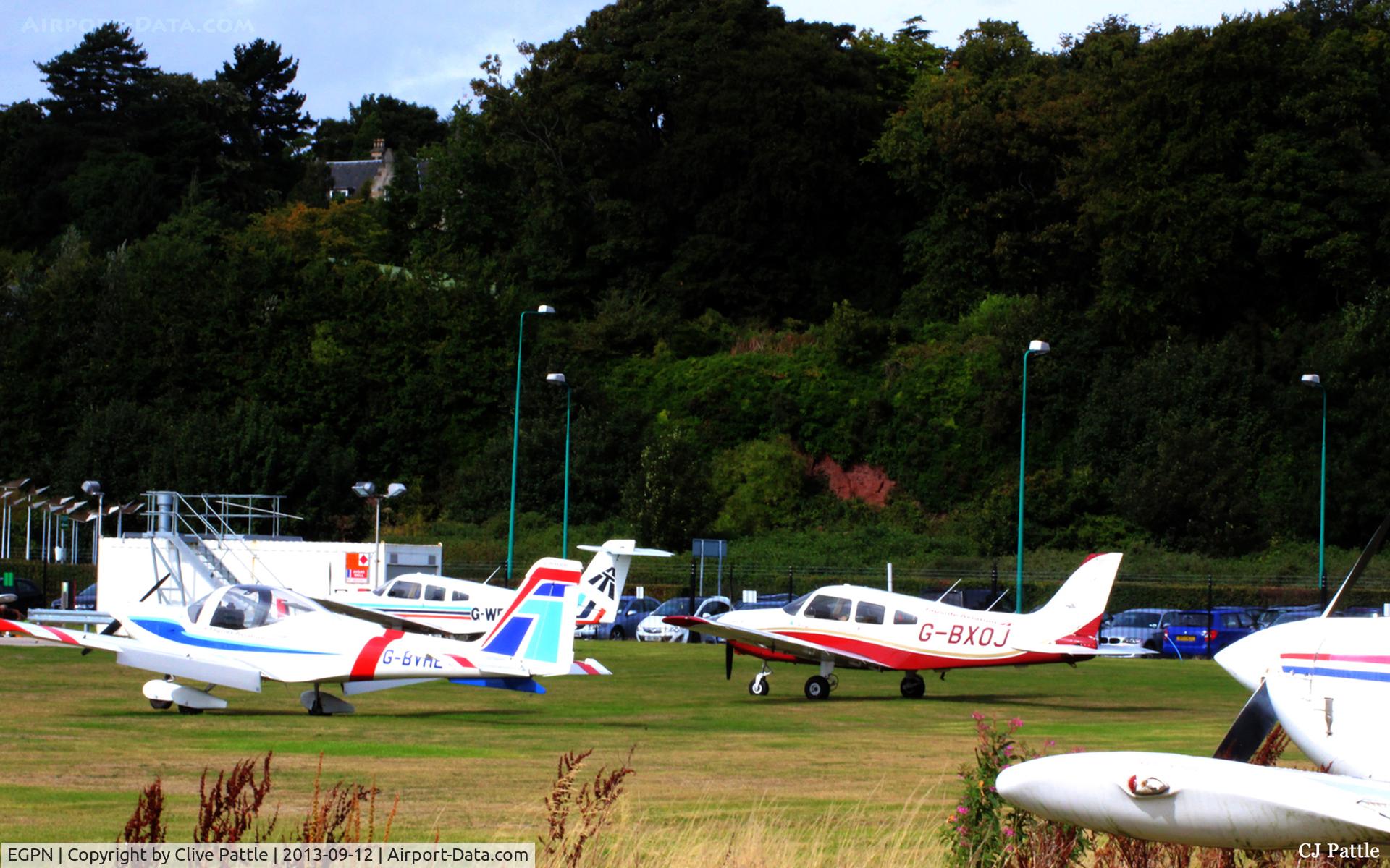 Dundee Airport, Dundee, Scotland United Kingdom (EGPN) - The GA parking area, mostly used by Tayside Aviation aircraft.