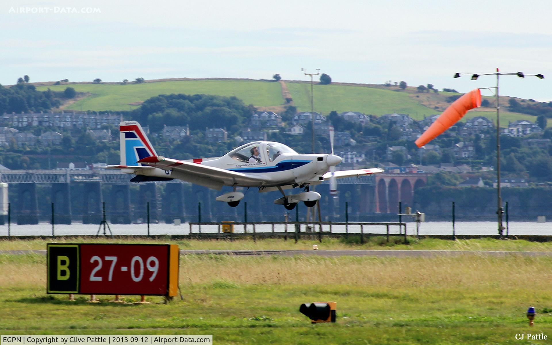 Dundee Airport, Dundee, Scotland United Kingdom (EGPN) - A view across the airfield towards the River Tay with a Grob Heron of the based Tayside Aviation about to land yet again.
