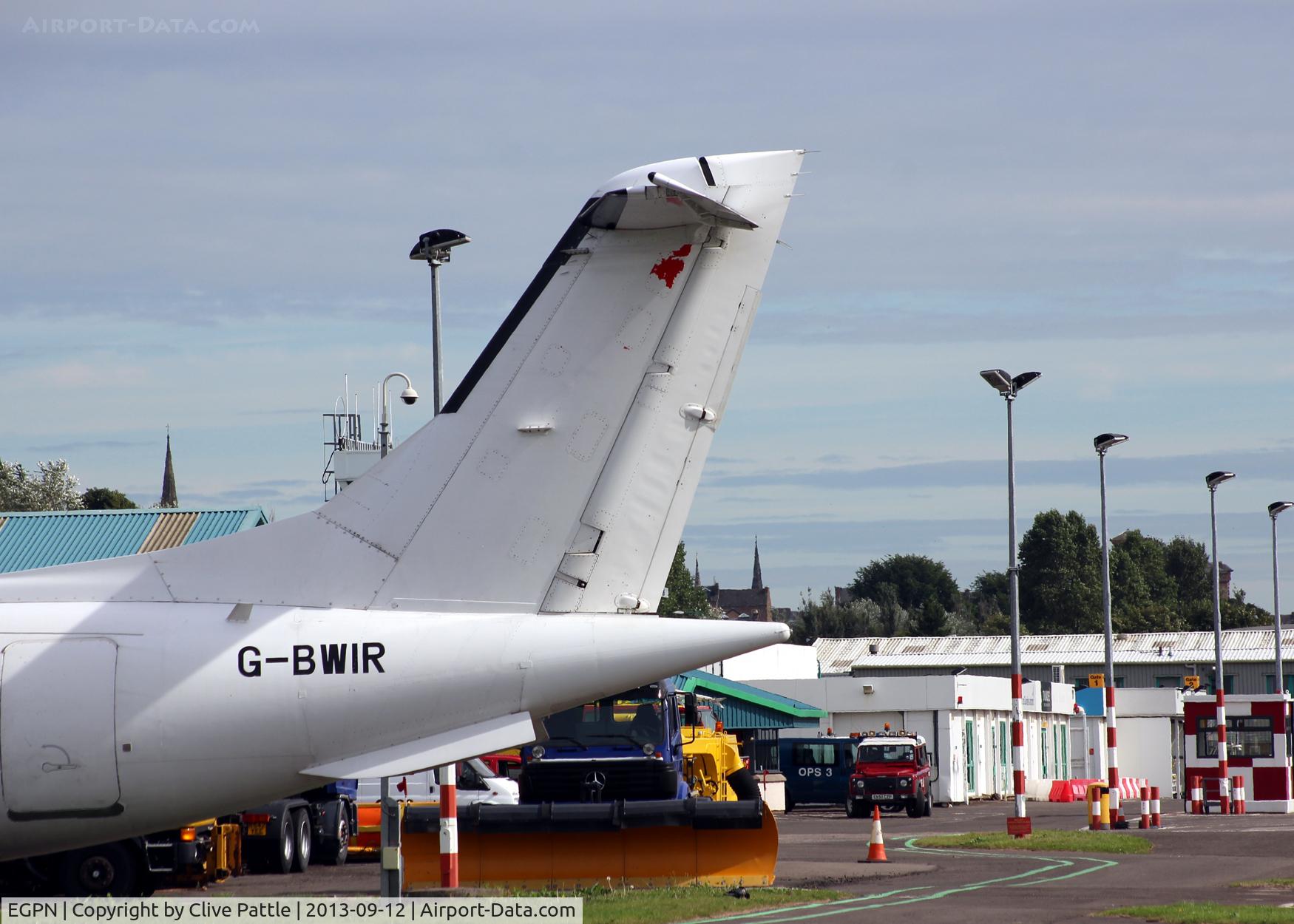 Dundee Airport, Dundee, Scotland United Kingdom (EGPN) - A view of the maintenance area at Dundee Riverside, with the tail of a Dornier 328 parked at the Loganair/Flybe engineering facility at the airport.