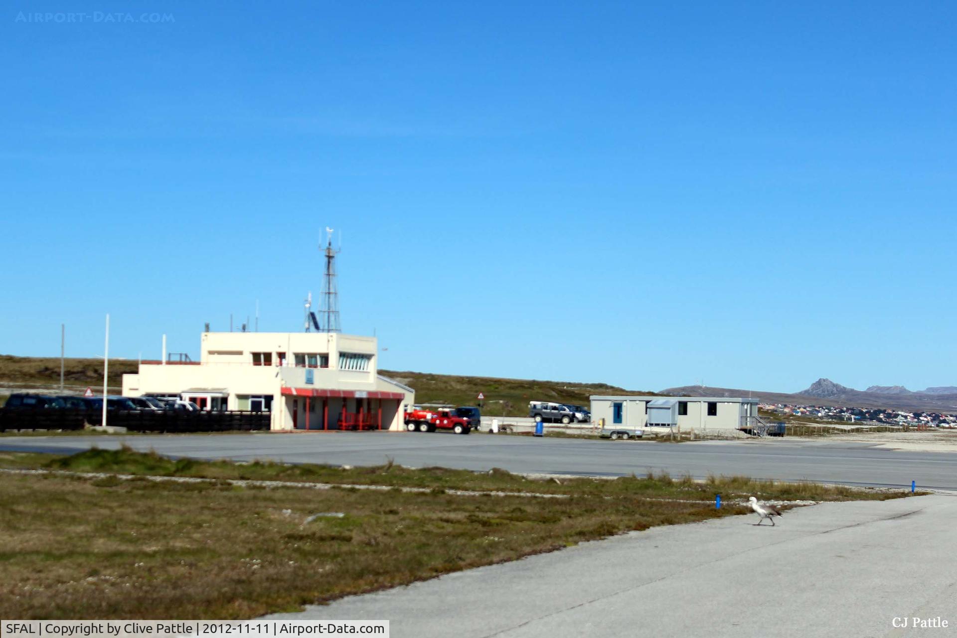 SFAL Airport - View taken from the main runway looking west towards the terminal buildings with a glimpse of Stanley in the background