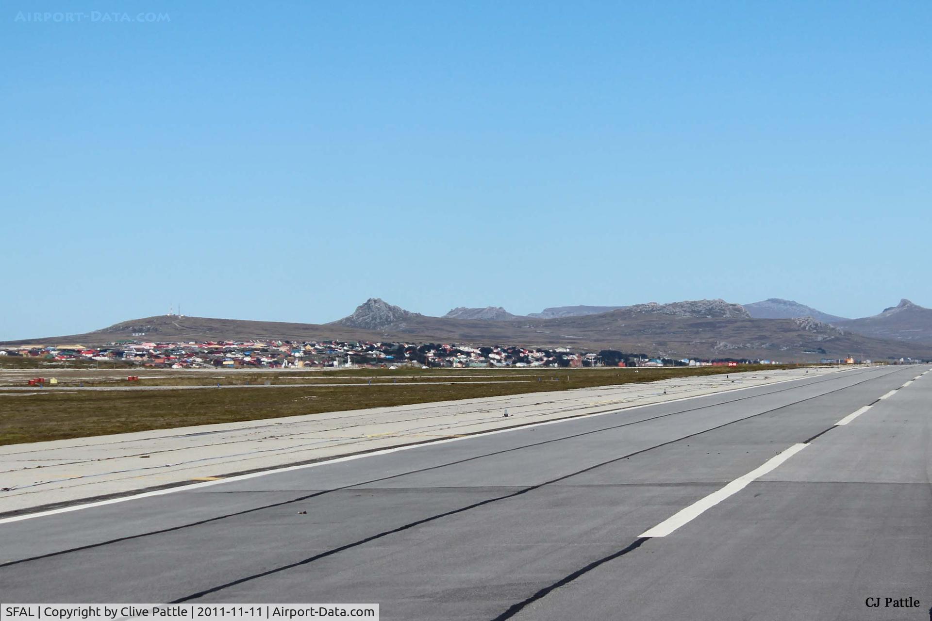 SFAL Airport - A long view of the town of Port Stanley taken from the airfield (SFAL). Such is the clarity of the air in the South Atlantic that it is difficult to judge distance. For example the mountains in the background are at least 12km away.