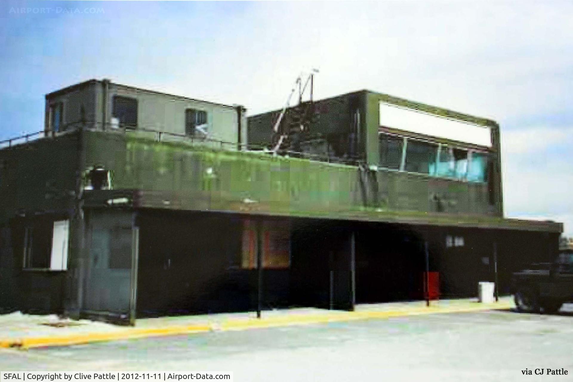 SFAL Airport - An historical view of the airport terminal at Port Stanley SFAL taken after the 1982 war with the apron repaired but the terminal still covered in its war paint.