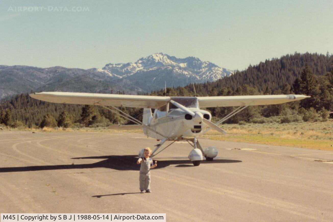 Alpine County Airport (M45) - N6905D at Alpine Co with its veteran pilot pointing toward the runway(unknown why) as he eats lunch.View is almost due south.Trail to the Walker river is on the right of 05D.