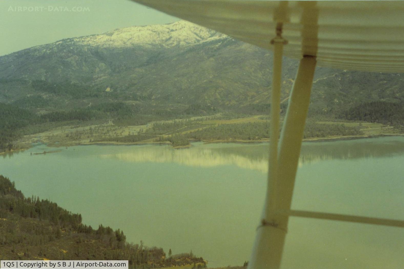 Gravelly Valley Airport (1Q5) - View is from the south to the north-northwest and Hull Mt with its winter covering of snow. This picture shows why for some aircraft, it is a one way strip. Good size hill to climb over.