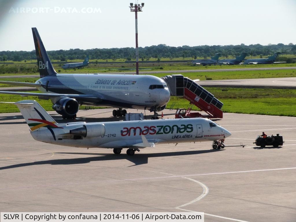 Viru Viru International Airport, Santa Cruz Bolivia (SLVR) - A CRJ-200 of Amazsonas (CP-2742) being towed in front of the B767 of BOA (CP-2881).  In the back, three B727 and one B737 of Aerosur, all out of service 
