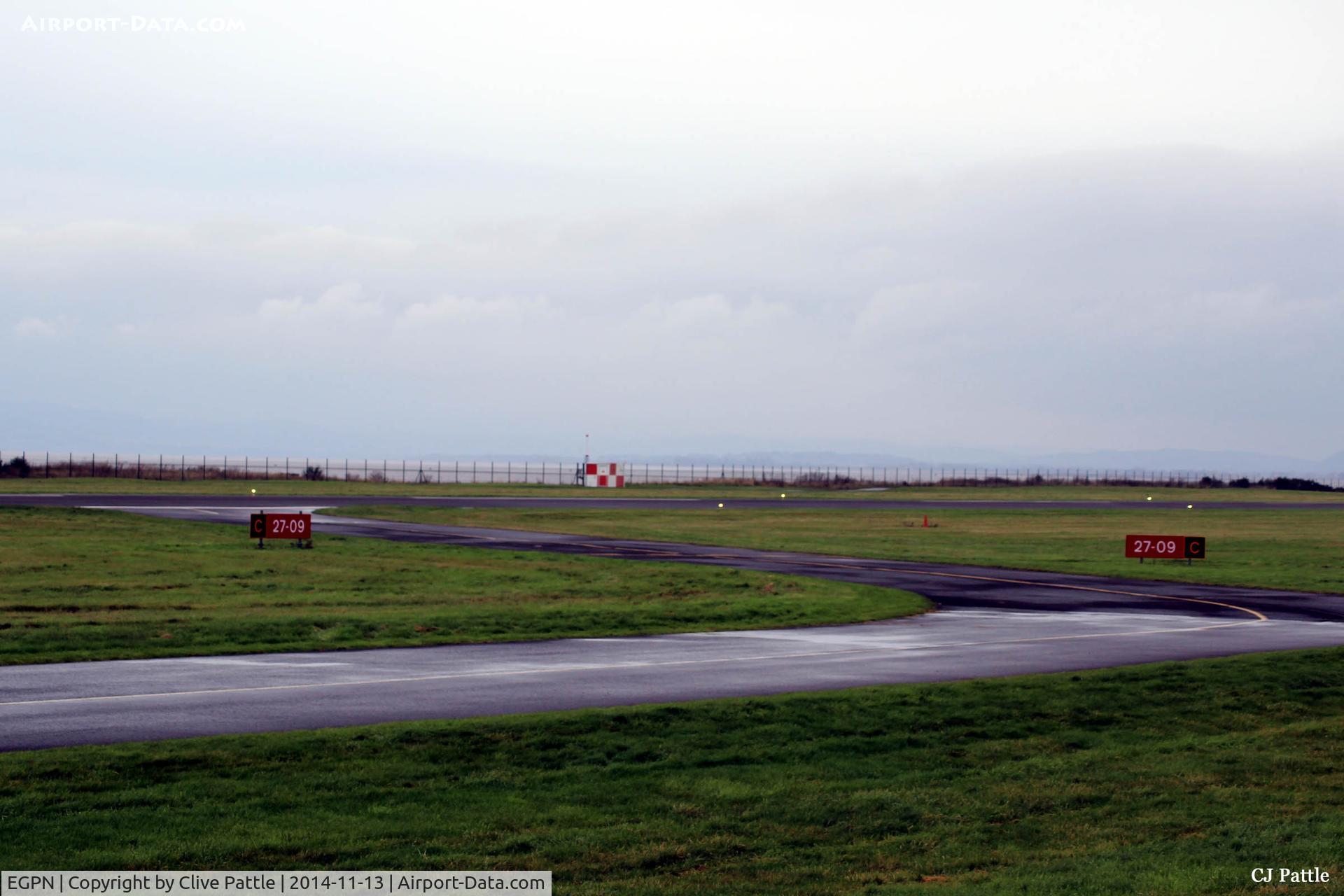 Dundee Airport, Dundee, Scotland United Kingdom (EGPN) - Threshold of taxiway and runway 09-27 at Dundee