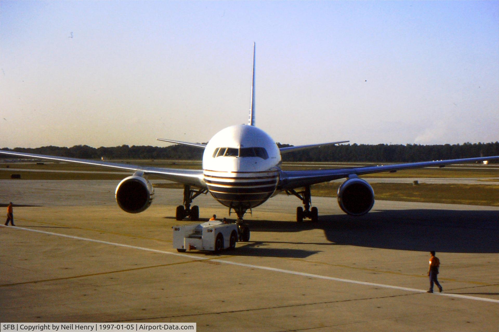 Orlando Sanford International Airport (SFB) - Britannia Airways Boeing 767 - as seen from terminal building at SFB.
Scanned from original slide.